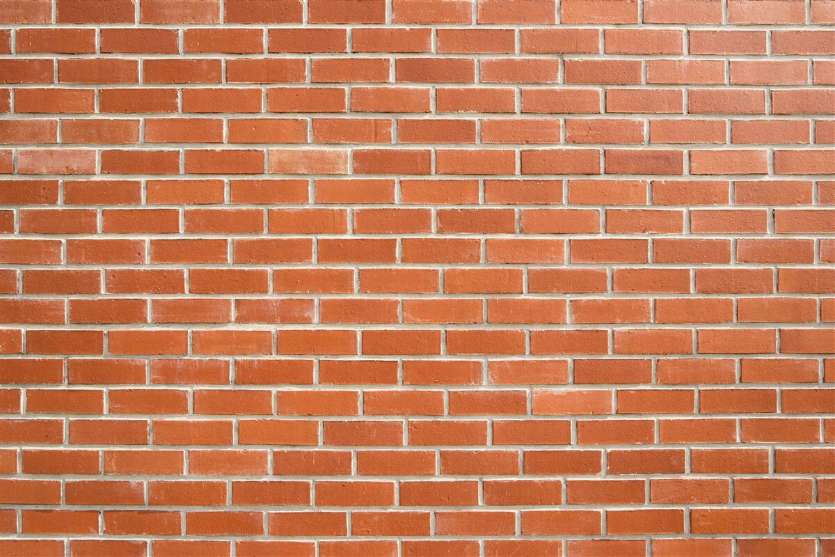 Fototapeta Ściana z czerwonej cegły, ułożona gładko