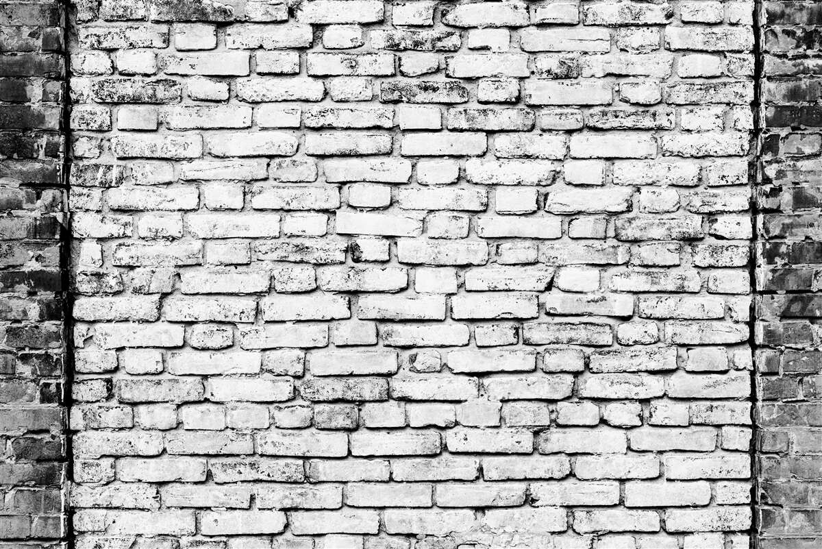 Fototapeta Ściana z cegieł ze śladami zarysowań