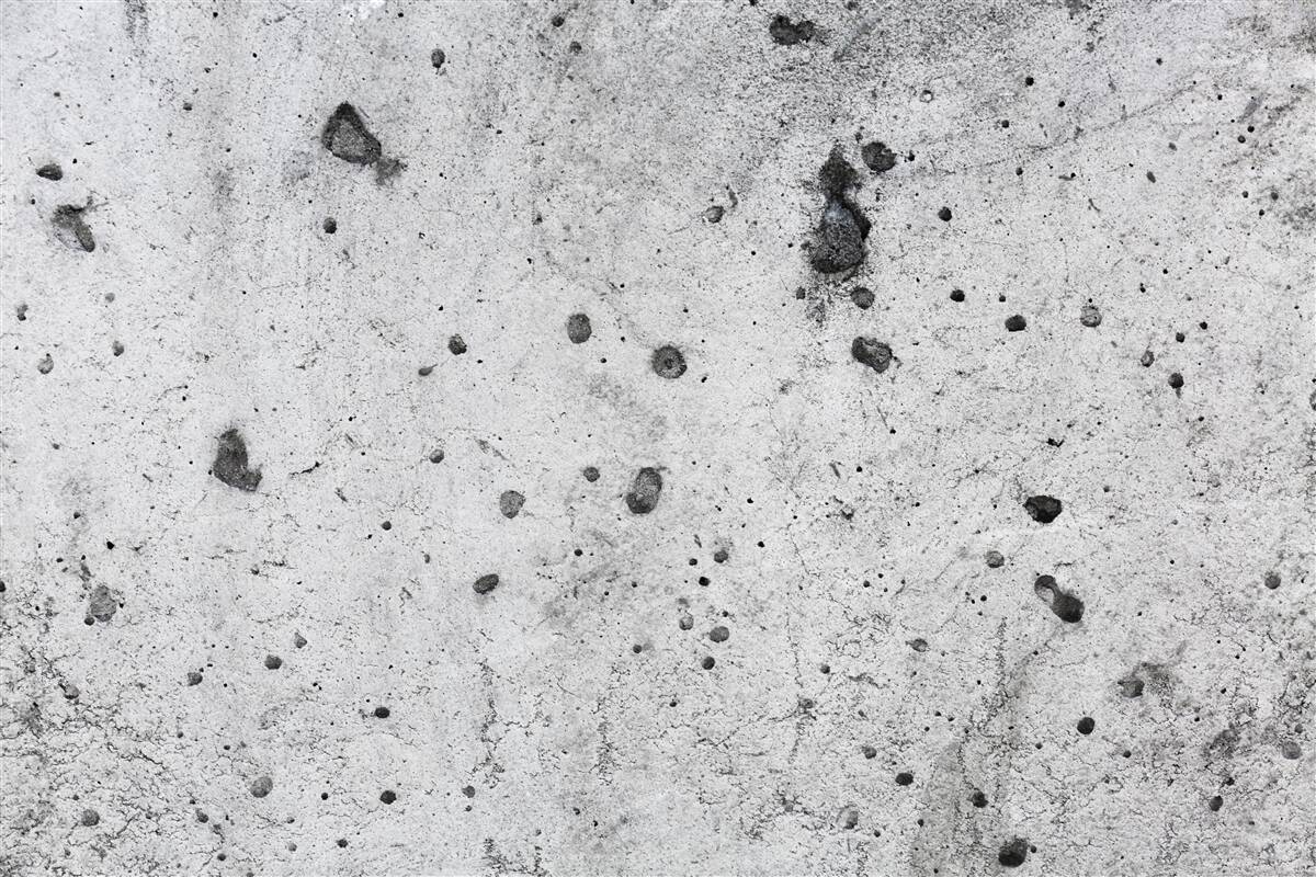 Fototapeta betonowa ściana z ciemnymi śladami