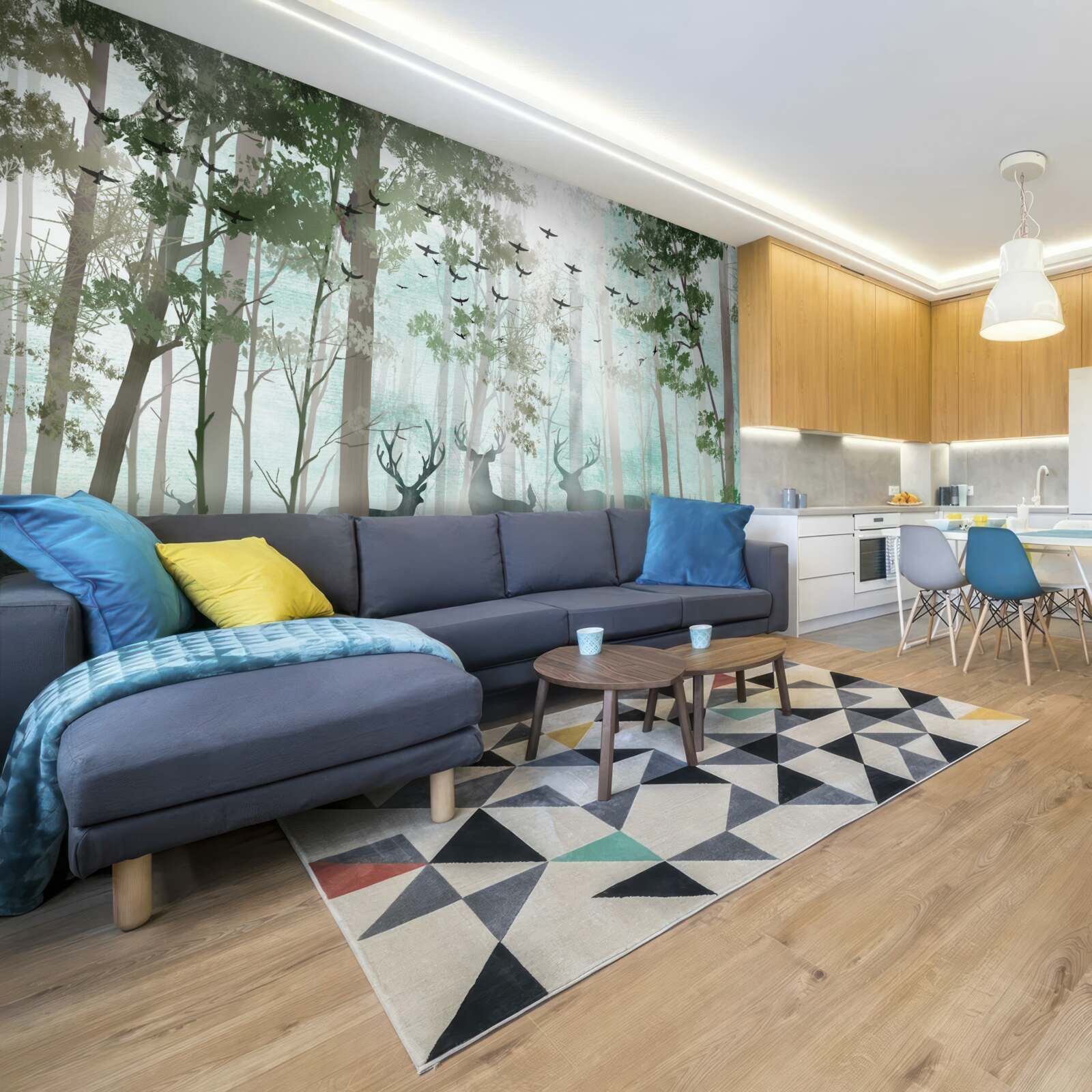 Fototapeta grupa jeleni wita poranek w mglistym lesie