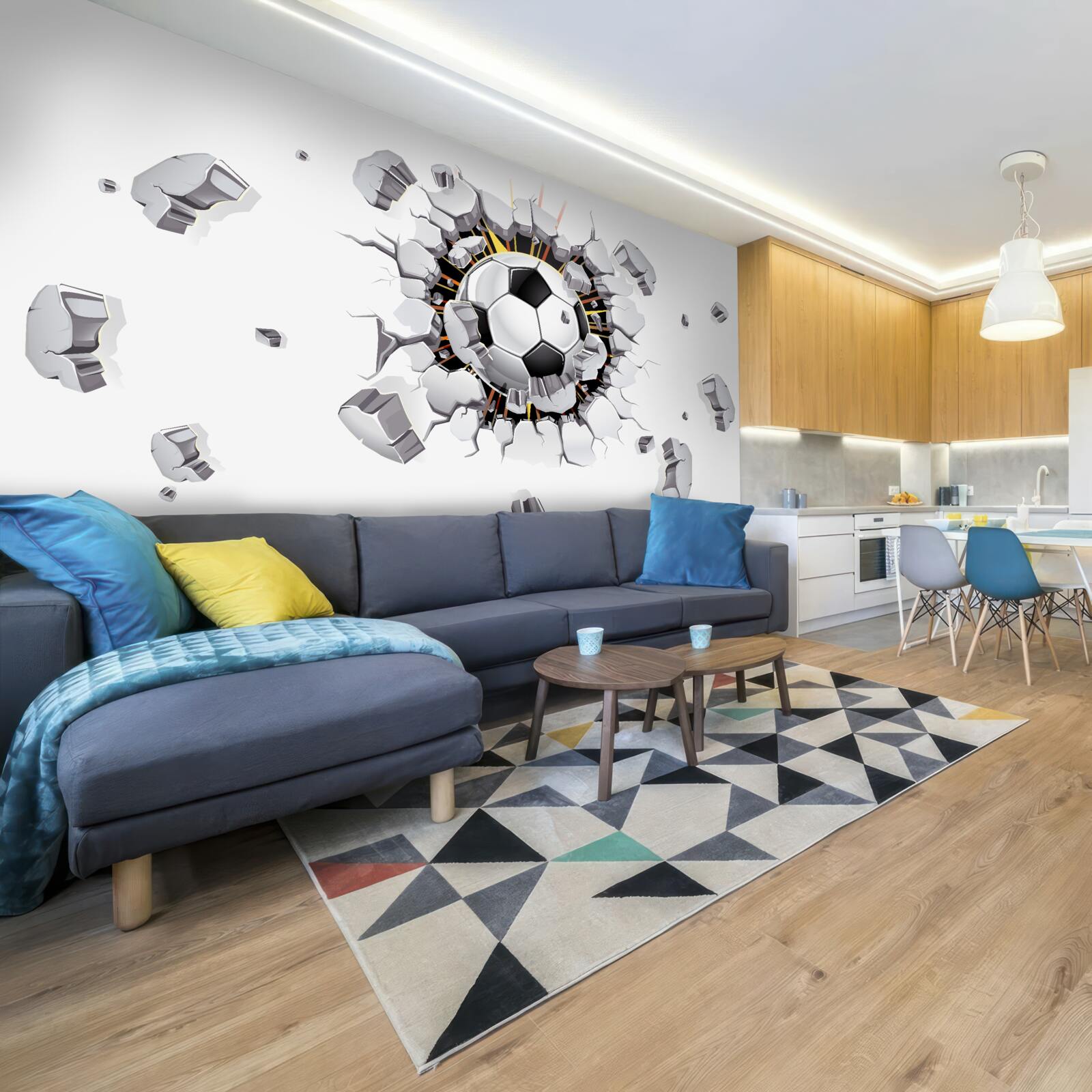 Fototapeta Ściana została przebita piłką nożną