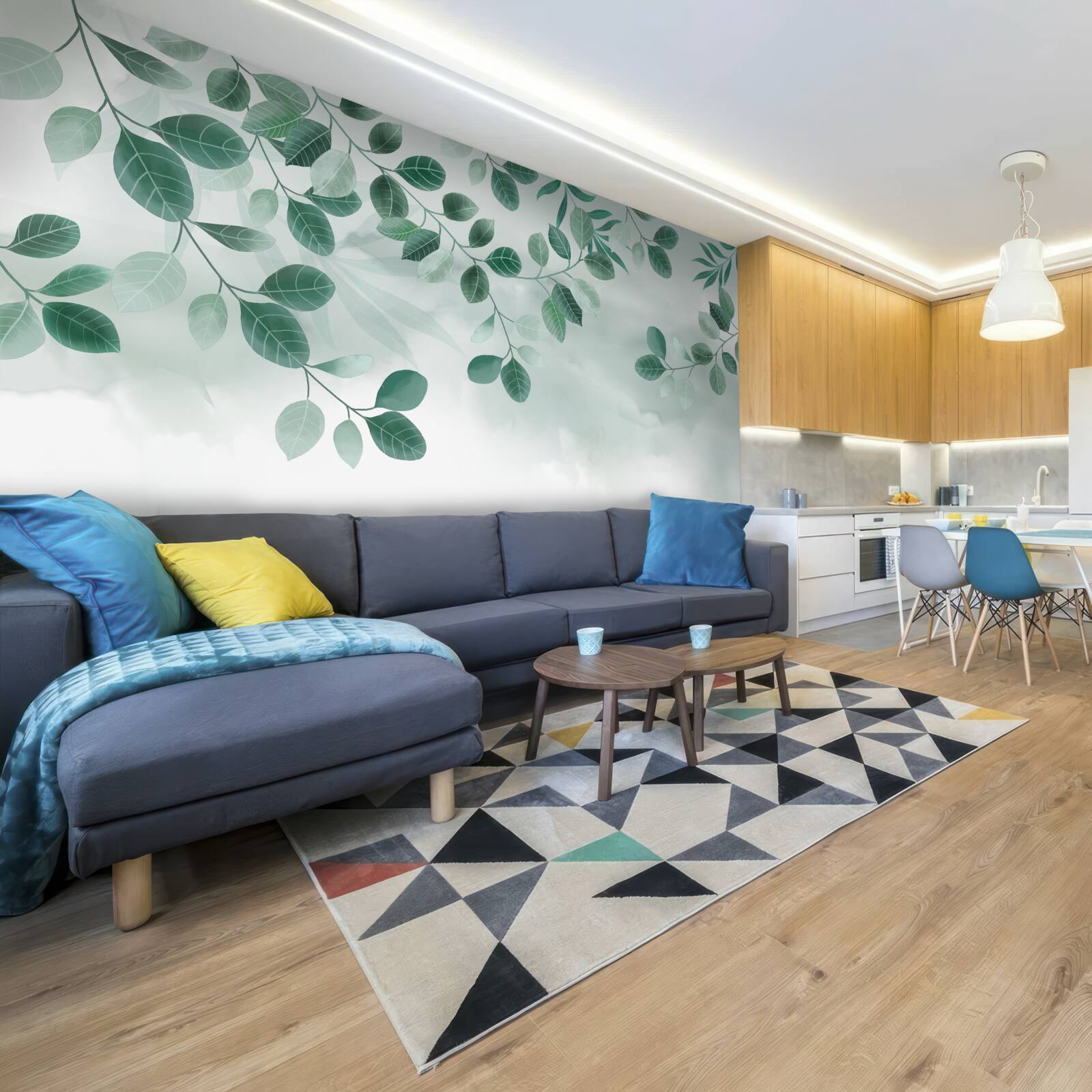 Fototapeta gałęzie z zielonymi liśćmi rozpościerają się na tle nieba