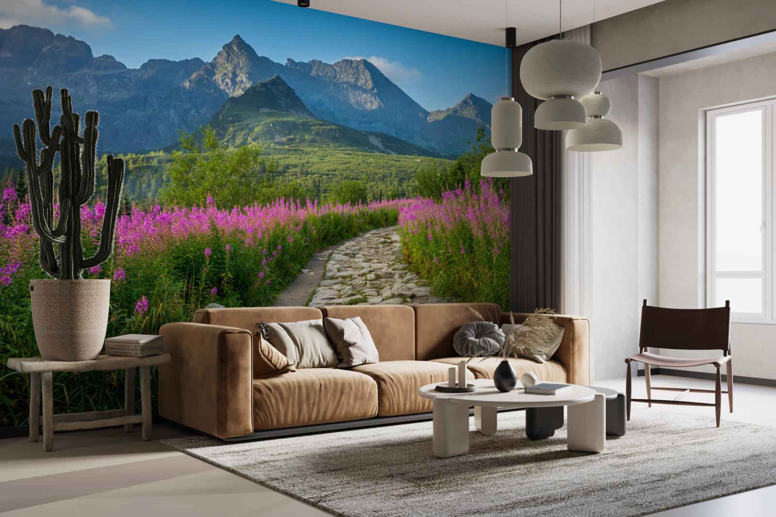 Fototapeta Ścieżka po środku kwitnącego pola na terenie górzystym