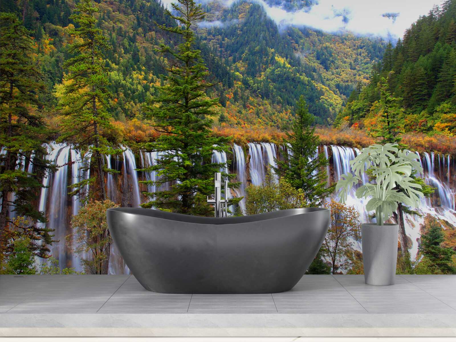 Fototapeta ogromny wodospad spływający po zboczach gór