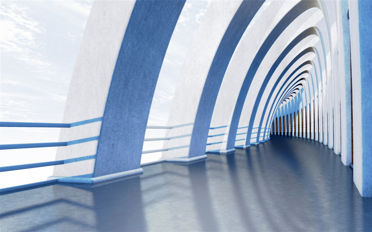 Fototapeta przejście otoczone kolumnami pod jasnym niebem