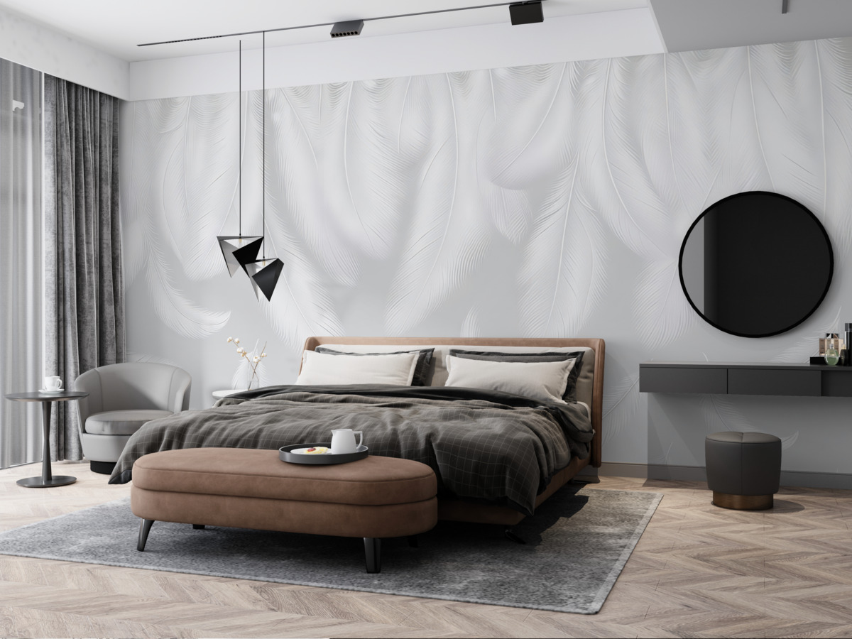 Fototapeta Subtelne białe pióra opadające z góry na przyjemnym szarym tle.