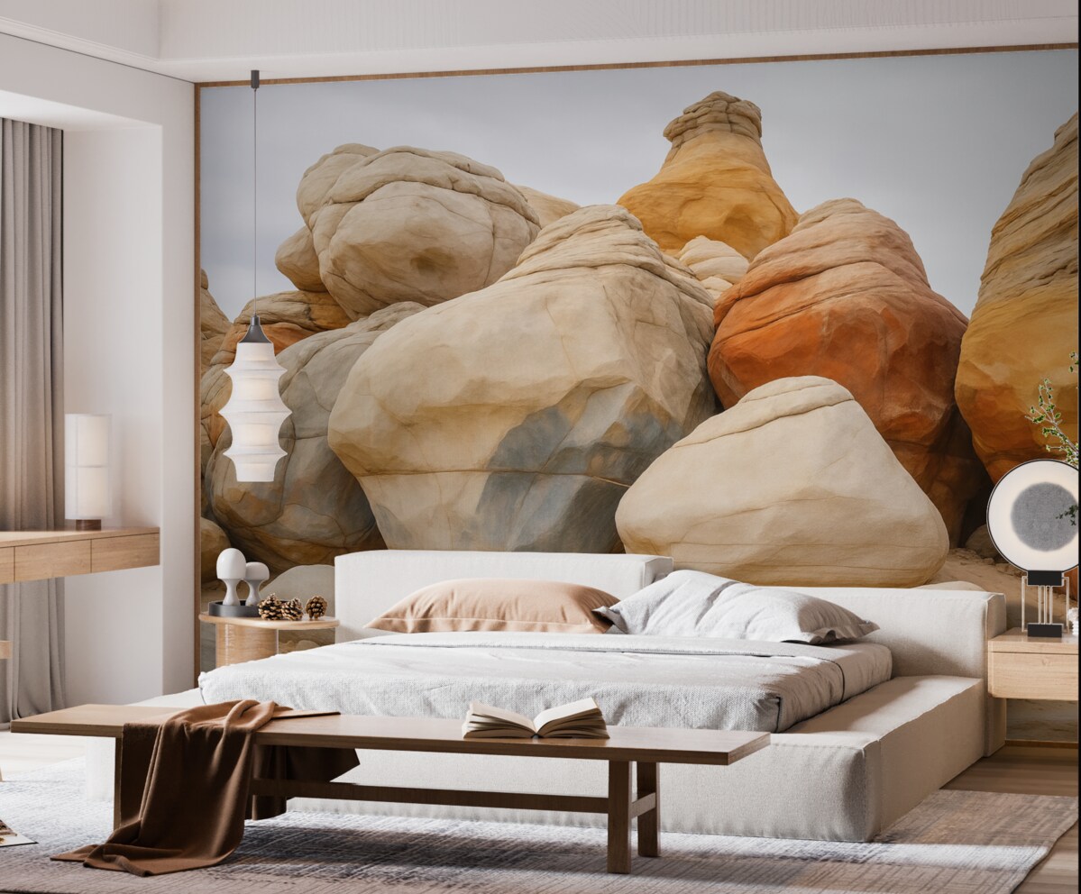 Fototapeta Wielkie kamienie na piasku przypominające akwarelę.