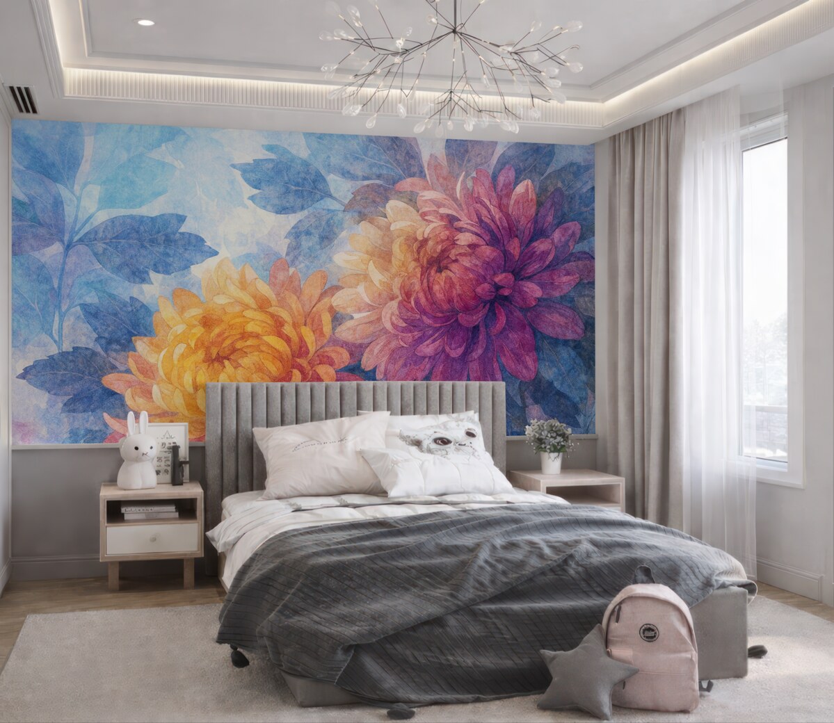 Fototapeta Wielkie, rozkwitające kwiaty dalii w kolorach pomarańczowym, żółtym i różowym na subtelnym, rozmytym błękitnym tle.