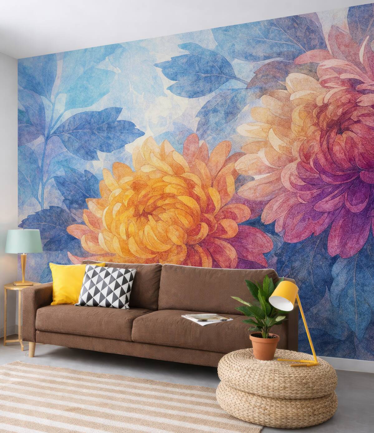 Fototapeta Wielkie, rozkwitające kwiaty dalii w kolorach pomarańczowym, żółtym i różowym na subtelnym, rozmytym błękitnym tle.