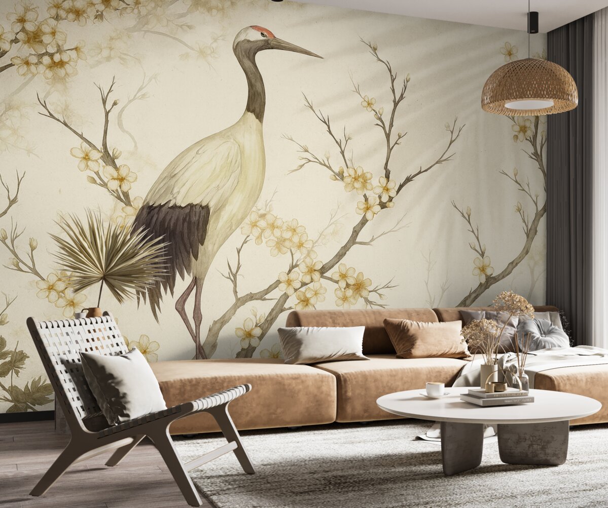 Fototapeta Biały żuraw stojący na konarze z kwitnącymi roślinami na delikatnym, rozmytym tle.