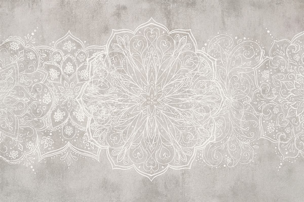 Fototapeta Szczegółowy, kunsztowny wzór mandali z białej koronki na teksturowanym tle szarej ściany w stylu industrialnym.