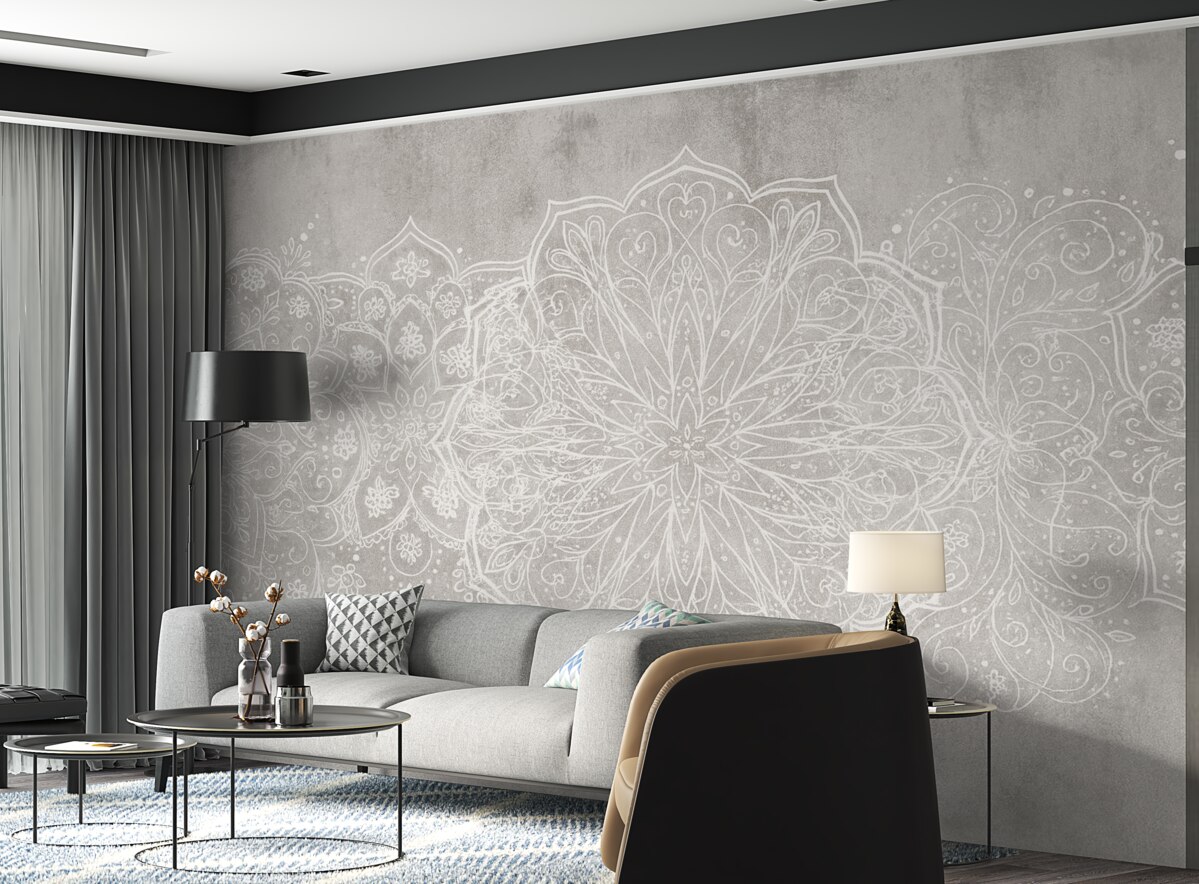 Fototapeta Szczegółowy, kunsztowny wzór mandali z białej koronki na teksturowanym tle szarej ściany w stylu industrialnym.