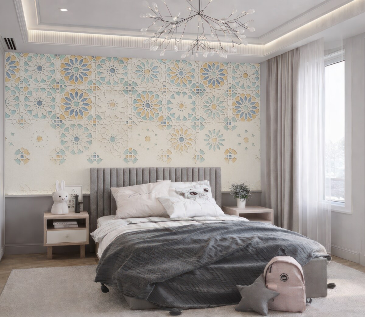 Fototapeta Ściana o fakturze, na której znajduje się powtarzający się motyw złożonych, dekoracyjnych wzorów w tonacjach błękitu, szarości i beżu.