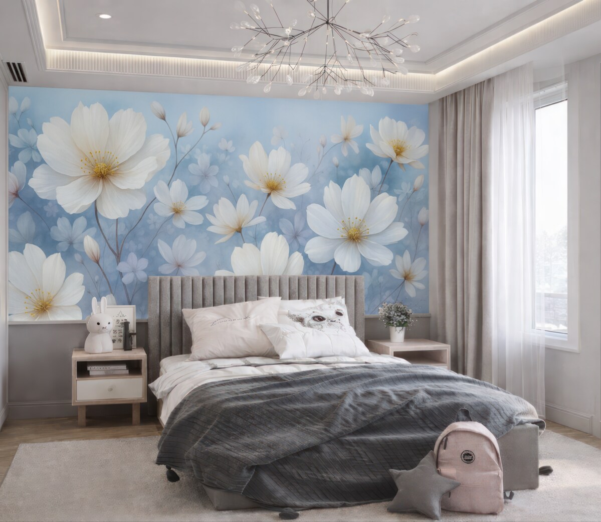 Fototapeta Subtelne białe kwiaty z gładkimi płatkami na rozmytym niebieskim tle, kreujące radosną i lekką atmosferę.