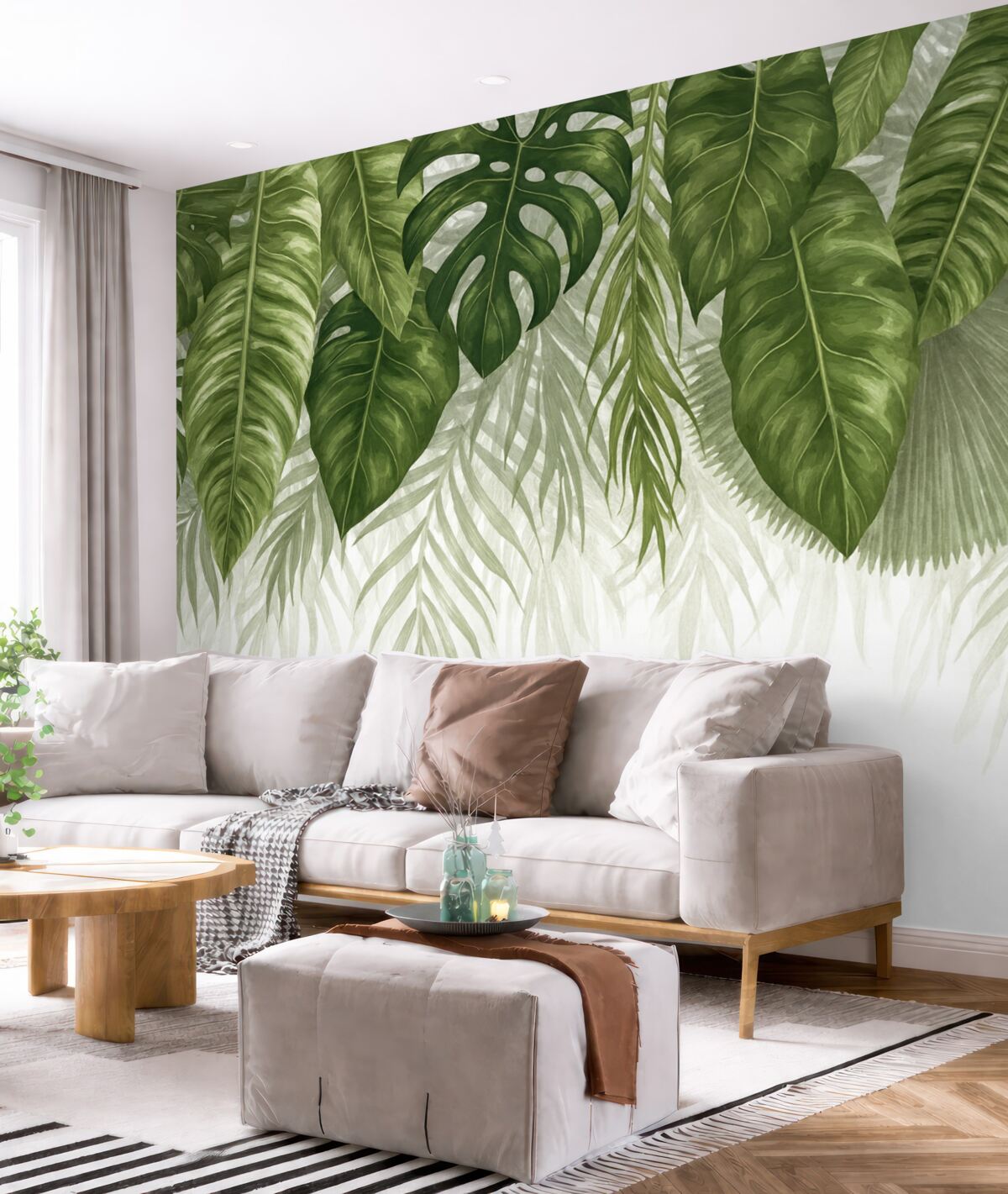 Fototapeta Tropikalne liście w różnych odcieniach zieleni, w tym spore liście monstery i palmowe liście na jasnym tle.