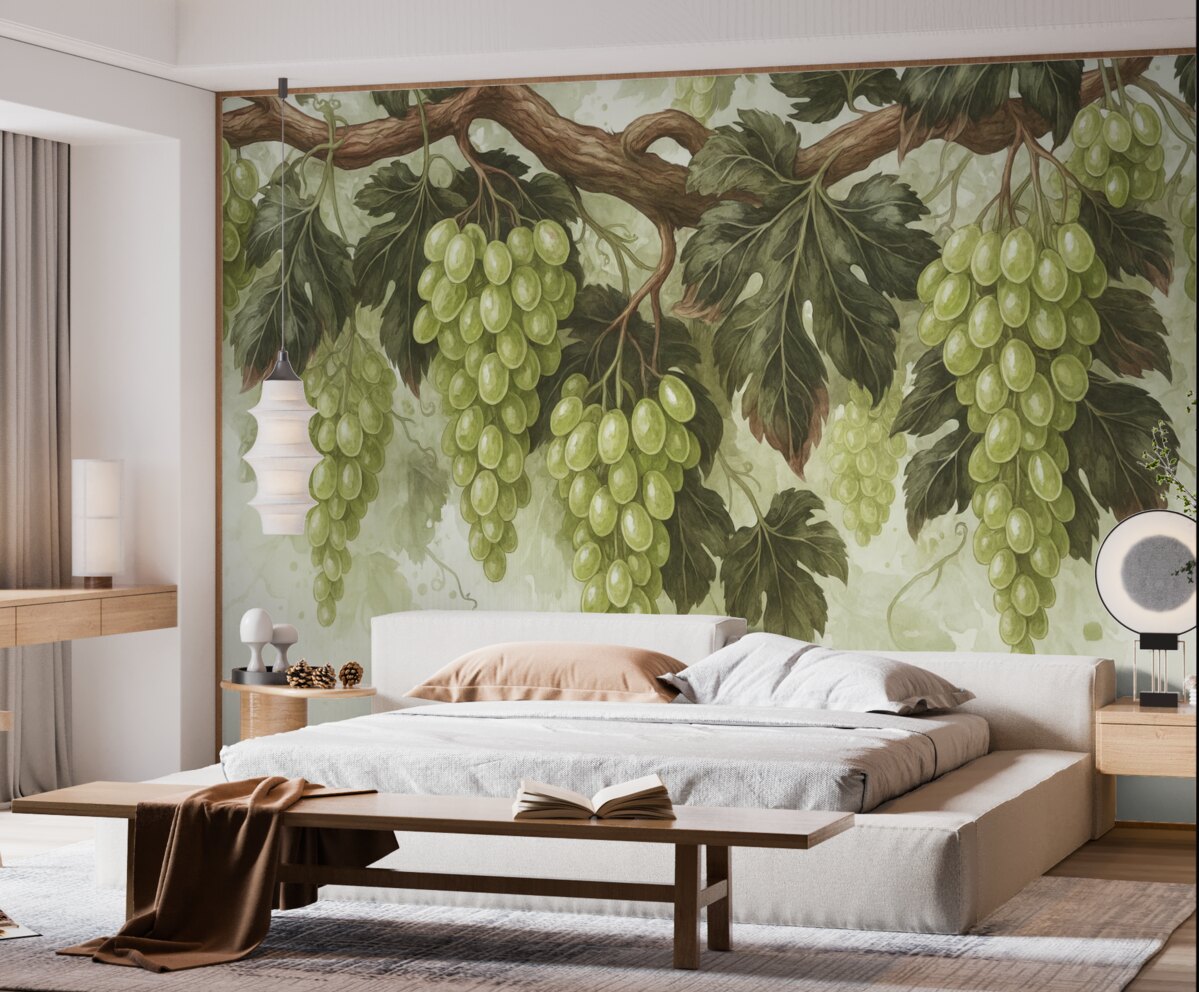 Fototapeta Winogrona zawieszone na winorośli z zielonymi liśćmi, na jasnym tle o fakturze przypominającej akwarelę.