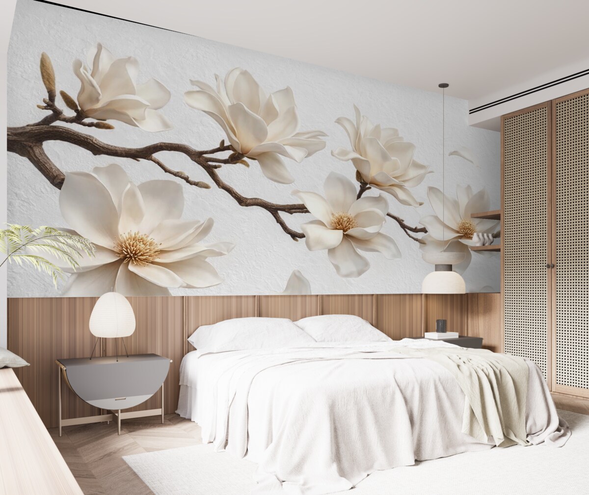 Fototapeta Gałązka drzewa z subtelnymi kwiatami magnolii i opadającymi płatkami.