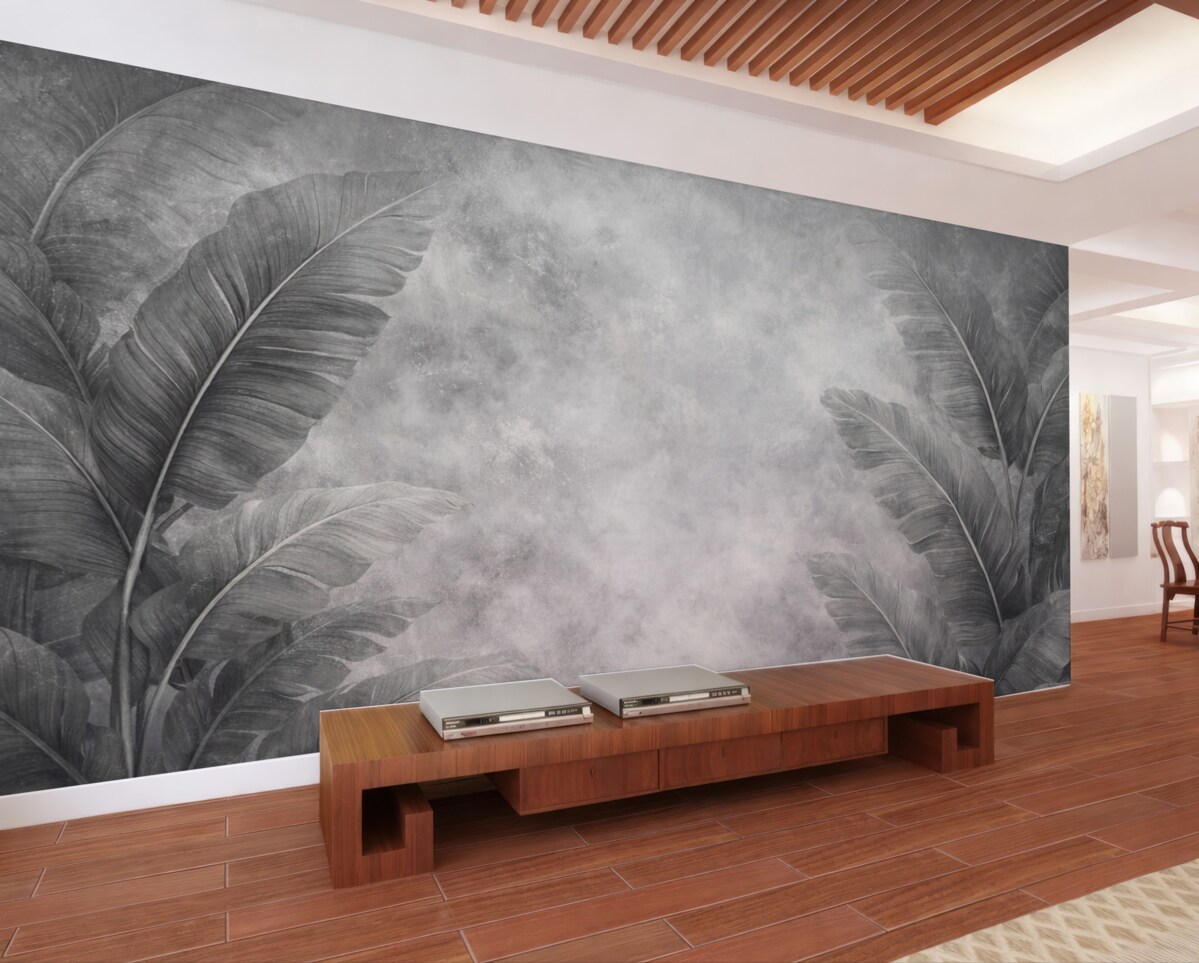 Fototapeta Ogromne liście bananowca na postarzałej ścianie.