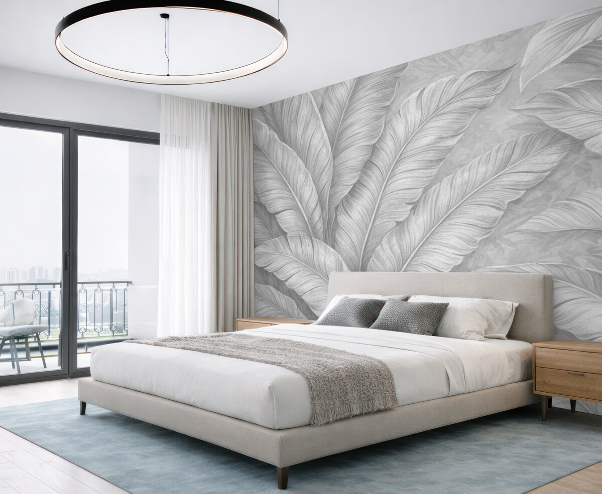 Fototapeta Szczegółowe, duże liście tropikalne w jednolitym, jasnym odcieniu szarości w stylu loftowym.